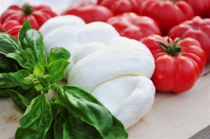 Delicious bulls heart (or heirloom) tomatos with fresh green basil